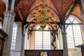 Interior view of historic Oude Kirk (church) windows, in Amsterdam city, The Netherlands