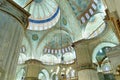 interior view of the iconic Blue Mosque or Sultan Ahmet Mosque in Istanbul, with domes and cupolas and Islamic art decorations Royalty Free Stock Photo