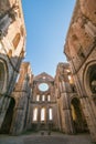 Interior view of the iconic roofless Abbey of San Galgano, a Cistercian Monastery in the town of Chiusdino, province of Siena