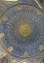 Interior view of the lofty dome covered with polychrome tiles of the Shah Mosque, which is situated on the south side of  Naqsh-e Royalty Free Stock Photo