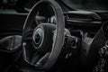 Interior view of a luxury black McLaren vehicle, with its sleek and stylish design.