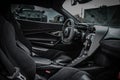 Interior view of a luxury black McLaren vehicle, with its sleek and stylish design.