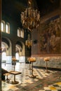 Interior view of the main hall of the Alexander Nevsky Cathedral with votive candles and images