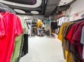 Interior view of a mister lady clothing store in Austria. View of different clothing hanging in a modern shop