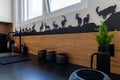 Interior view of a modern and elegant kitchen with white cupboards and black counter top with decorative ibex metal work Royalty Free Stock Photo