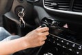 Interior view of a modern new car. Woman`s hand and climatronic or air conditioner system concept Royalty Free Stock Photo