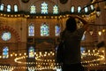 An interior view of Mosque in Turkey and a girl visitor