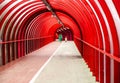 Interior view with mother and daughter of the Smartie Tube, the SECC elevated red steel and perspex covered walkway and cycle lane