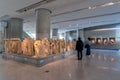 Interior view of the new Acropolis Museum in Athens city. Visitors are admiring the archaeological exhibits