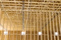 Interior view of a new house under construction framing the beams stick Royalty Free Stock Photo