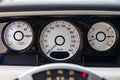 Interior view of new a very expensive car, a long black limousine with dashboard, speedometer and tachometer Royalty Free Stock Photo