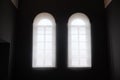 Interior view in old building with two windows - soft light from window and dark in the room Royalty Free Stock Photo