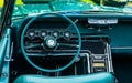 Interior view of old vintage car. View on dashboard of classic car