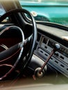 Interior view of old vintage car. View on dashboard of classic car