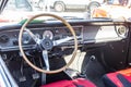 Interior view of an Opel Rekord old-timer car with a dashboard and a steering wheel Royalty Free Stock Photo