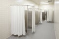 Private showers in a high school locker room. Royalty Free Stock Photo