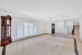 Interior view of a room with white walls and tiled floors in a brand-new house