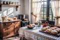 Interior view of a simple-designed kitchen with pastry on table and daylight from a big window Royalty Free Stock Photo