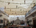 Interior view of a store hanging many traditional dolls in Tlaquepaque