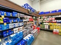 Interior view of a supermarket with alcohol aisle with shelves full of variety of products