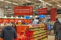 Interior view of a Swedish ICA supermarket with shoppers near shelves stocked with various goods. Royalty Free Stock Photo