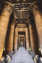 Interior View of the Temple of Edfu with Carved Pillars and Ancient Egyptian Drawing on the Wall Royalty Free Stock Photo