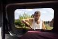 Man using a file to deburr a window opening in a camper van Royalty Free Stock Photo
