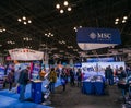 Interior view of visitors enjoying the MSC Cruises pavilion at the New York Travel and Adventure