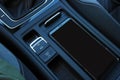 Interior view of a Volkswagen vehicle on the Auto Hold button and the resting position of a smartphone. Royalty Free Stock Photo