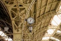 Interior of the Vitebsk railway station. Round Roman clock and glass roof of railway or subway station. Twelve o`clock, seven past