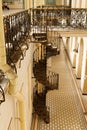 Interior of the Vitebsk railway station. Vintage metal spiral stairs staircase and fence,