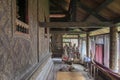 Interior wall decoration with gilded black lacquer inside Buddhist scriptures library at Wat Mahathat Temple, Yasothon, Thailand