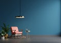Interior wall mockup in blue tones with red leather armchair on dark wall background Royalty Free Stock Photo