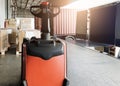 Interior of warehouse dock. Electrick forklift pallet jack and shipment pallet boxes waiting for load into container truck. Royalty Free Stock Photo