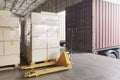 Interior of warehouse dock. Large shipment pallet boxes waiting for load inti container truck.