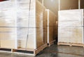 Interior of warehouse storage. Large shipment boxes on pallets.