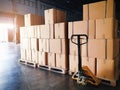 Interior of warehouse storage, stack package of shipment boxes on pallets.