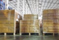 Interior of warehouse storage, stack package of shipment boxes on pallets.