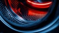 The interior of a washing machine is illuminated by bright lighting, highlighting the drum and various wash features Royalty Free Stock Photo
