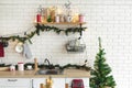 Interior white kitchen with lights and red christmas decorations Royalty Free Stock Photo