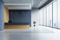The interior of a white office waiting room has a blue reception area Royalty Free Stock Photo