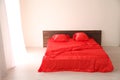 The Interior of the white room with a bed with red Royalty Free Stock Photo