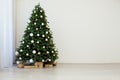 Christmas interior of the white room green Christmas tree with red gifts for the new year decor winter holiday Royalty Free Stock Photo