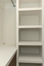 Interior white solid wood closet with wood shelves Royalty Free Stock Photo