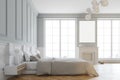 Interior of a white stylish master bedroom side