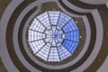 Interior winding staircase with glass rooftop of Frank Lloyd Wright famous modernist masterpiece, the Guggenheim Museum