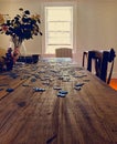 Long view of puzzle pieces on an interior wooden table