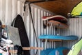 Interior of windsurf boards storage room in old rusty metal shipping container box with racks on wall. Used shabby