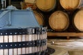 Interior of winery with basket press and stack of barrels in the background Royalty Free Stock Photo