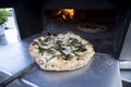 interior of a wood-fired oven with pizza cooking Royalty Free Stock Photo